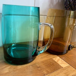 Fabulous retro coloured glass tankards.
