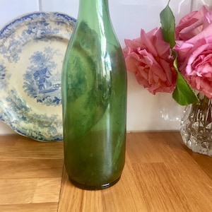 Antique green glass bottle.