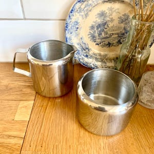 Vintage  stainless steel milk jug and sugar bowl.