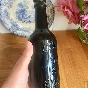 Antique brown glass Longton beer bottle.