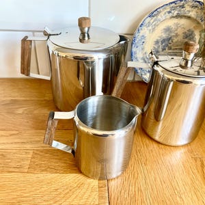 Vintage  stainless steel connaught shaped tea pot /coffee pot set. Mid century modern. Trio.