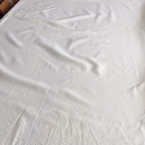 Retro 1970&#39;s pale yellow tablecloth.