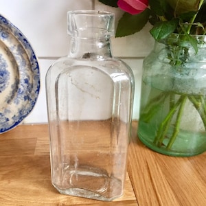 Antique clear glass bottle.