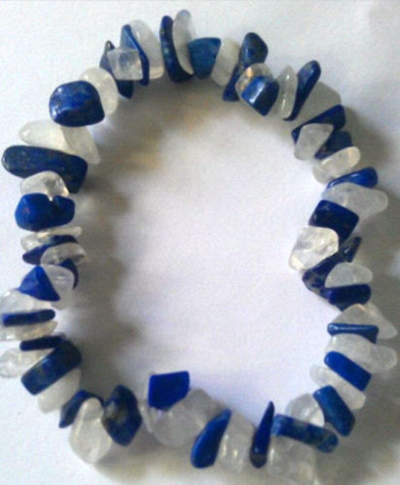 May include: A bracelet made of white and blue gemstone chips. The bracelet is made of natural stones and is a beautiful and unique piece of jewelry.
