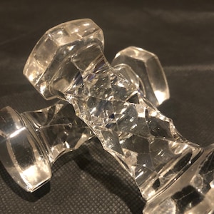 A pair of glass knife rests
