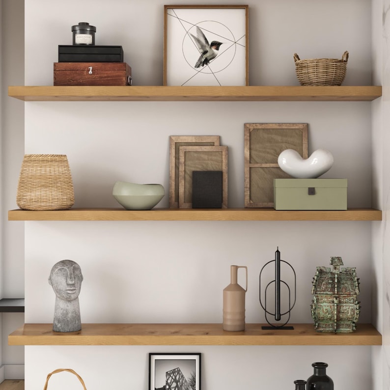 Floating shelves in a living room with decor.