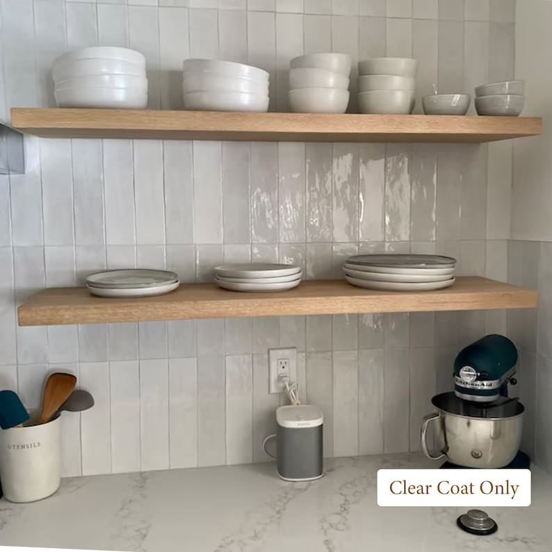 two white oak floating shleves with dishes on them.