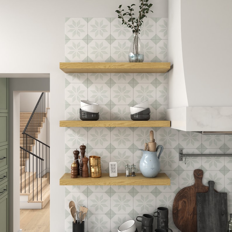 three white oak floating shelves in the kitchen.