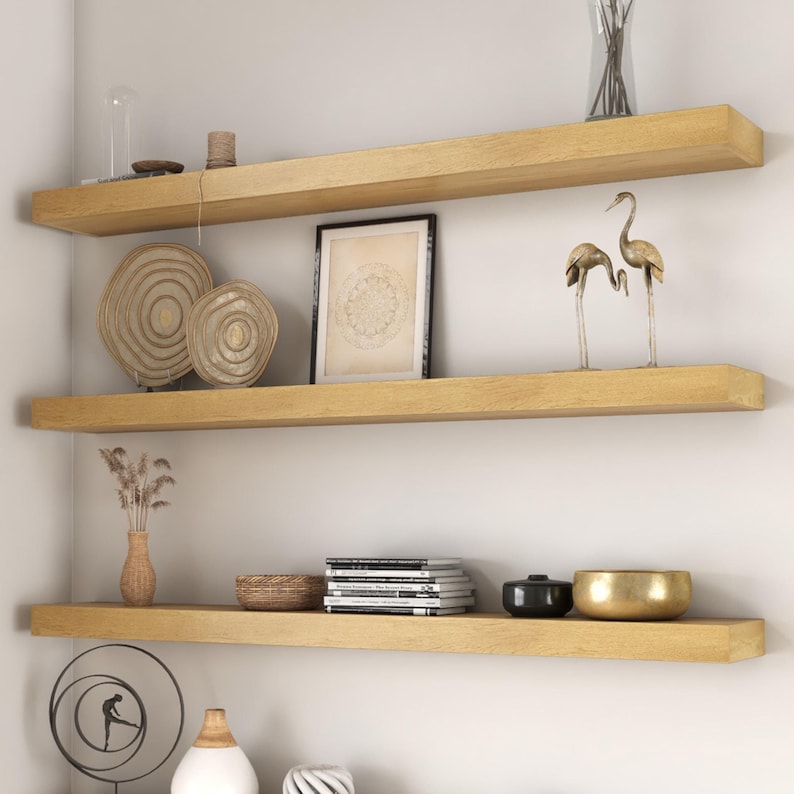 White oak floating shelves with decor.