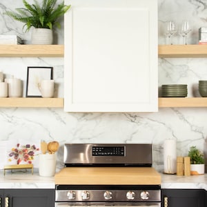 White oak floating shelves in a kitchen.