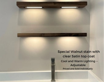 Walnut kitchen floating shelves with battery powered led lighting. bar, liquor, and whiskey floating shelf. solid wood wall shelf down light