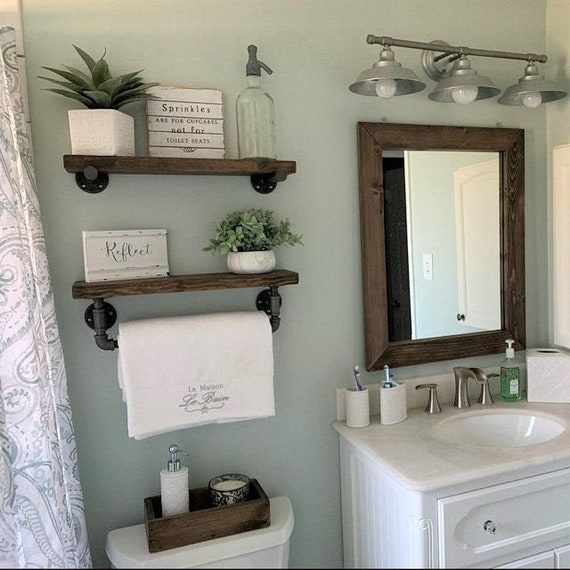 floating shelf under bathroom mirror