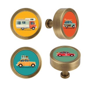 May include: Four round cabinet knobs with a brushed brass finish. Each knob features a circular insert displaying a different vehicle illustration: a white camper on yellow, a teal station wagon on orange, a yellow car on teal, and a red car on green.