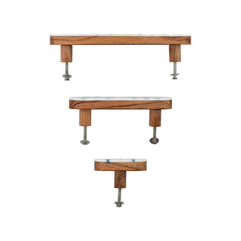 May include: Three cabinet pulls of varying lengths, each featuring a natural brown wood base topped with a white and blue patterned inlay. Each pull includes two cylindrical wooden supports and silver metal mounting screws extending downward.