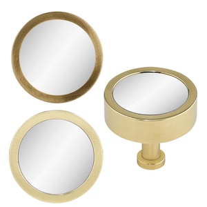 May include: Three gold-toned round mirror knobs. Two are flat and one is a round knob with a post.