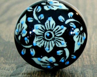 Embossed Flat Ceramic Knob with a White Floral Pattern