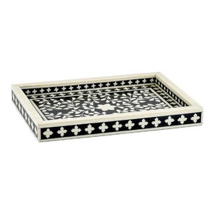 May include: Rectangular decorative tray with a black and white floral design. The tray has a cream-colored frame with black and white geometric patterns on the edges. The interior features a detailed floral pattern in white against a black background.