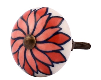 May include: A decorative ceramic cabinet knob with a floral design. The knob features a white base with a red and pink flower pattern outlined in dark blue. It has a brass-colored center and a threaded metal screw for attachment.