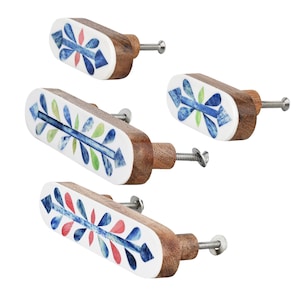 May include: Set of four decorative wooden cabinet knobs. Each knob features a white oval face with a colorful mosaic design in blue, red, and green. The knobs have a natural wood finish and a silver screw for installation.