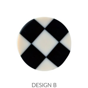 May include: A round, white and black checkerboard pattern coaster. The coaster has a black and white checkered design.
