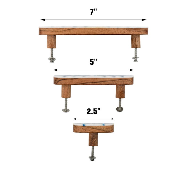 May include: Three cabinet pulls made of brown wood with white and blue marble-like tops. The top pull measures 7 inches, the middle pull measures 5 inches, and the bottom knob measures 2.5 inches. Each piece includes metal mounting hardware.