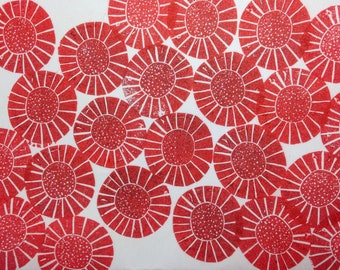 May include: Red and white abstract print with a repeating pattern of stylized sunburst shapes.