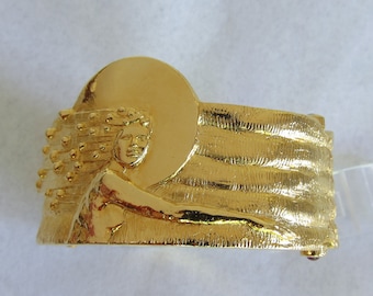 AMERICAN SUN imagine, the melting of nationalities. Gold plated.