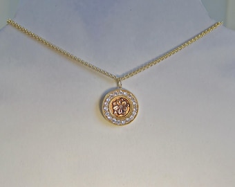 A gold timeless reliquary for the wild rose.