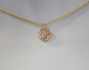 Wild rose gold pendant reliquary.