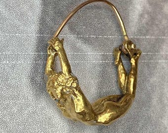 Aphrodite a earring swinging from your ear.