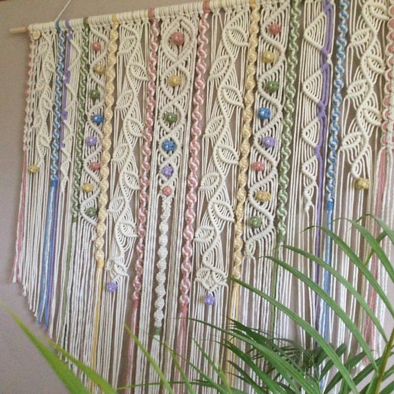 Carnival macrame wall hanging with pastel rainbow colours!