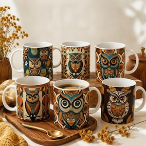 May include: Six ceramic mugs featuring various owl illustrations in shades of brown, teal, and cream. The mugs display geometric and floral patterns surrounding the owl motifs. One mug contains dark coffee, and a small gold spoon rests nearby.