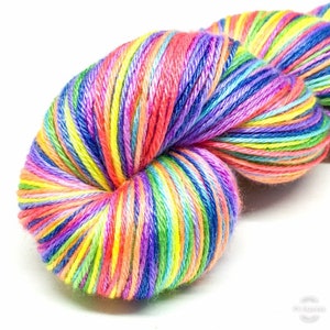 May include: A skein of colourful yarn with stripes of red, orange, yellow, green, blue, purple and pink.