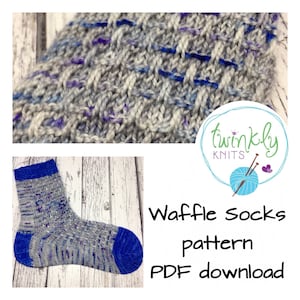 May include: A pair of blue and gray waffle knit socks with a pattern. The socks are on a white wooden background. The text "Waffle Socks pattern PDF download" is on the image.