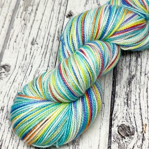 Turquoise rainbow sock yarn, hand dyed 4 ply merino wool, superwash sock wool, rainbow yarn