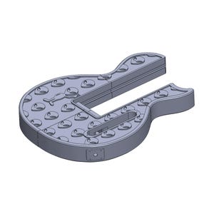 May include: A gray guitar-shaped object with a cut-out section. The surface is covered with evenly spaced, rounded indentations. A small, stylized figure is visible on the surface. The object appears to be made of a solid material.