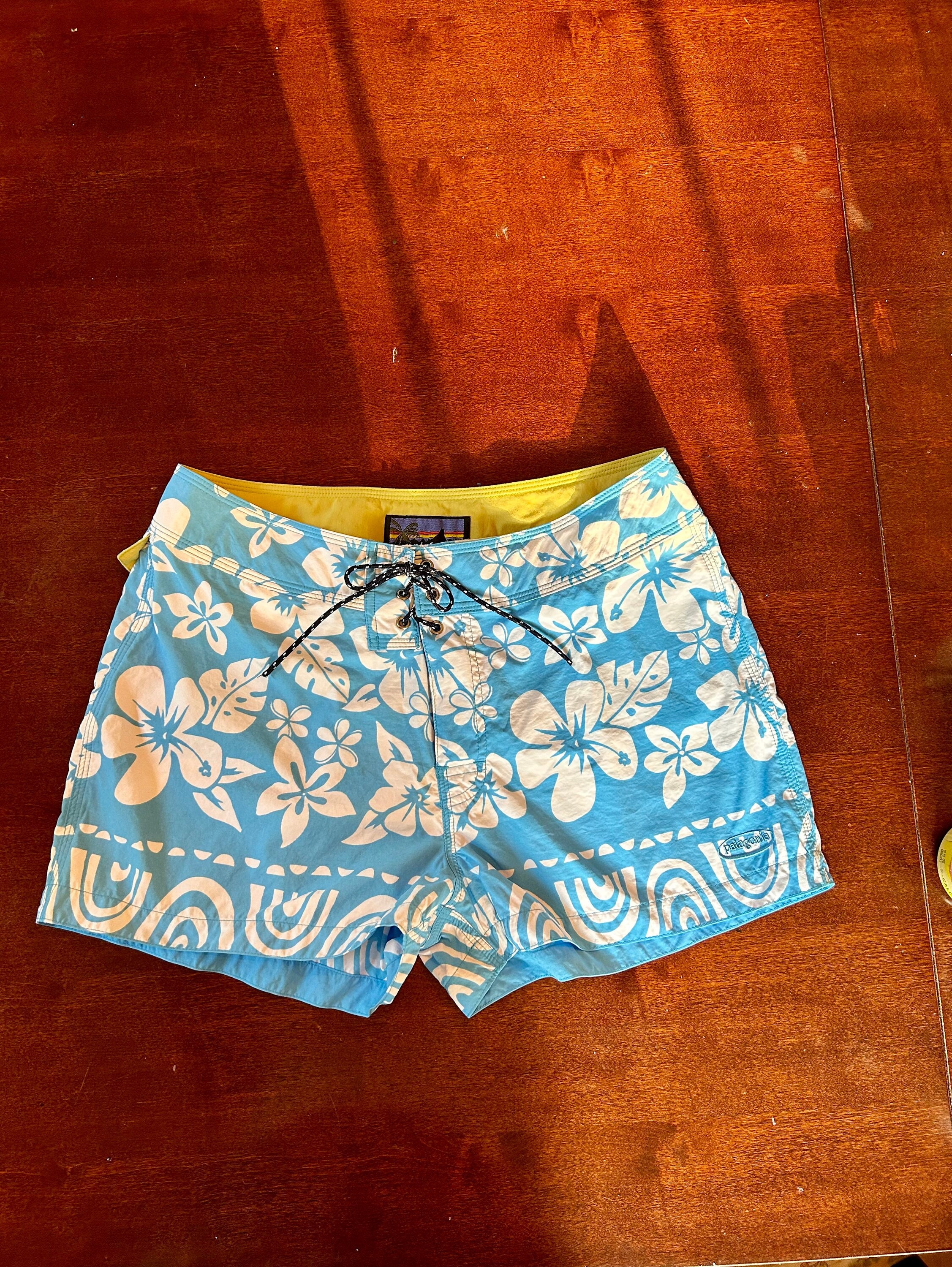 Mid lengh board shorts,all over monogram print