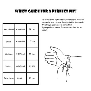 May include: A wrist measurement guide for bracelets. The guide shows different wrist sizes in inches and centimeters, with corresponding bracelet sizes. A hand is shown measuring a wrist with a tape measure.