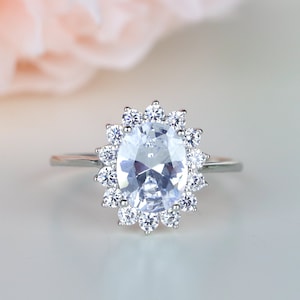Sunburst Halo Sterling Silver Ring: Oval Cut Simulants