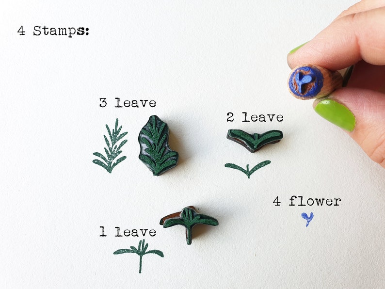 May include: Four stamps for crafting, featuring a blue flower, and three different green leaf designs. The text "4 Stamps" is written at the top of the image.
