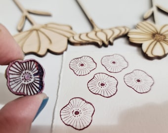 Poppy stamp Wood and rubber stamp represents a stylized poppy for patterns