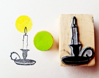 Candle stamp, stamp with lie and burning candle, small flame of light, decorative stamp