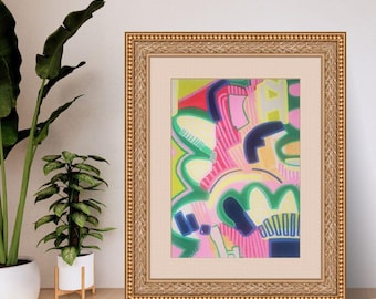May include: A framed abstract painting featuring vibrant layers of pink, lime green, yellow, and dark blue shapes. The artwork is encased in an ornate, textured gold frame with a wide, neutral-toned fabric matting surrounding the colorful print.