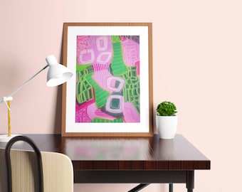 May include: A framed abstract art print featuring a vibrant composition of bright pink, lime green, and dark green shapes. The artwork includes hand-drawn lines, geometric squares, and textured patterns within a light wood frame on a dark desk.