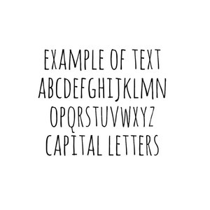 May include: A handwritten alphabet in black ink on a white background. The letters are uppercase and include the phrase "EXAMPLE OF TEXT CAPITAL LETTERS".