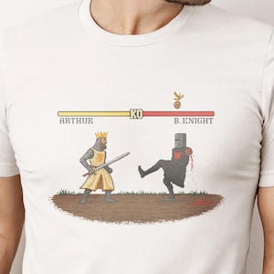 Funny Monty Python Video Game T-Shirt, Black Knight vs King Arthur Battle Graphic Tee, Classic Pixel Art Shirt, The Holy Grail Fan Gift