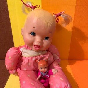 Baby tumbles doll top