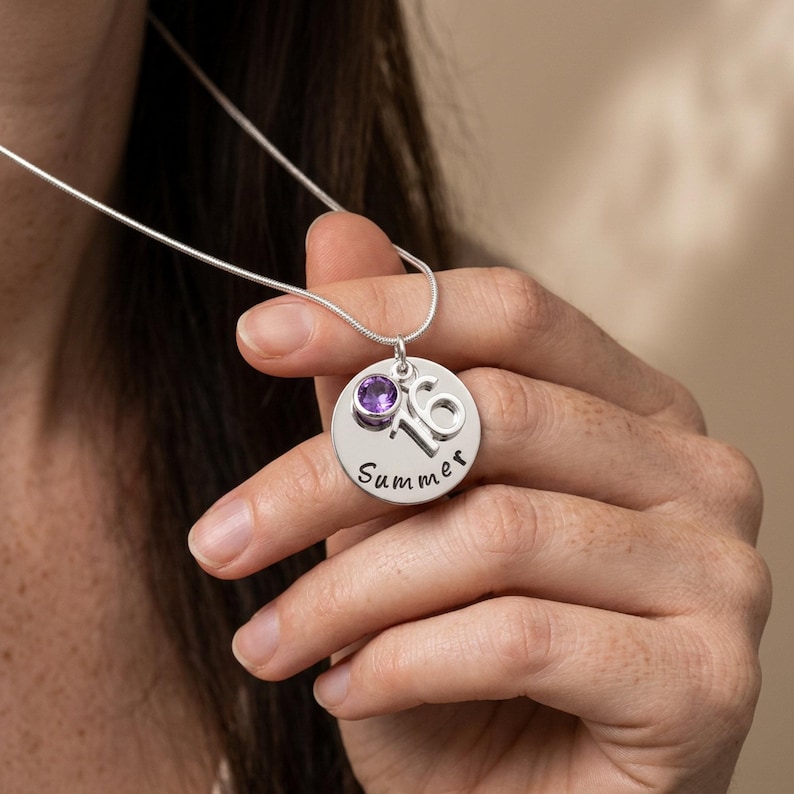 A personalised 16th birthday necklace with birthstone charm