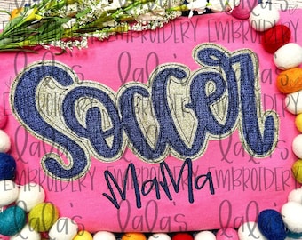 May include: Pink fabric with blue and gold embroidery that reads "Soccer Mama".