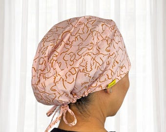 Golden Dogs on Pink Doodle scrub caps for women by tanza, satin lined scrub caps, ponytail scrub caps